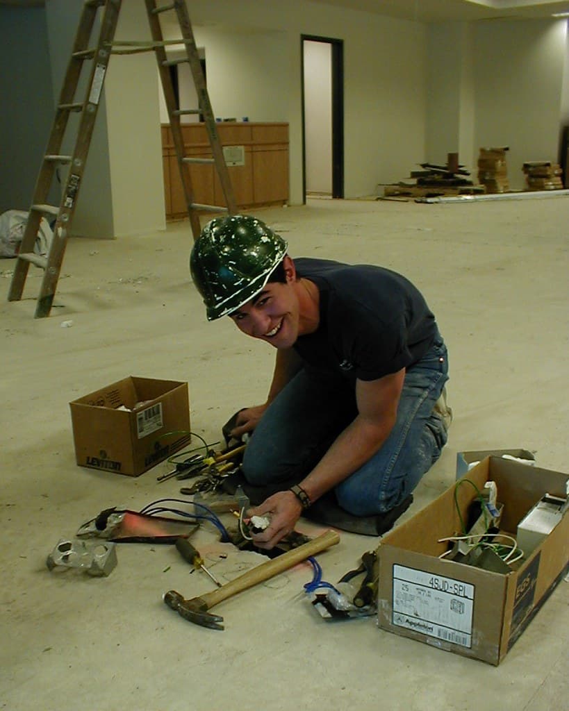 Electrician doing rough-in wiring during a renovation